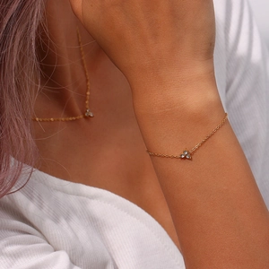 Minimalist 18K gold plated stainless steel bracelet with zircon lotus flower pendant