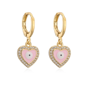 Golden heart earrings with pink evil eye enamel and clear zircons on white background