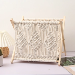Detail of bohemian hand-woven cotton rope texture and solid wood frame on magazine rack