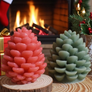 Pinecone scented candles on wood base with a cozy fireplace and Christmas background