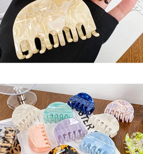 Detailed macro view of acetate hair claws in assorted marble textures and pastel colors