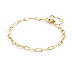 Detail of gold oval link chain bracelet featuring a lobster clasp and extension chain