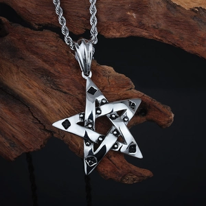 Detailed close-up of a silver pentagram star pendant with vintage texture and twist rope chain