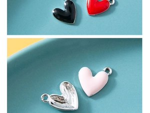 Detail of colorful heart charms for DIY jewelry making showing front and back texture