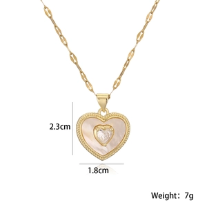 Macro detail of 18K gold-plated shell heart pendant necklace with dimensions and weight