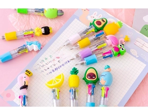 Close-up of 4-color cartoon ballpoint pens with silicone fruit and animal toppers