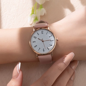 Minimalist women's quartz watch with pink leather strap and rose gold metal case