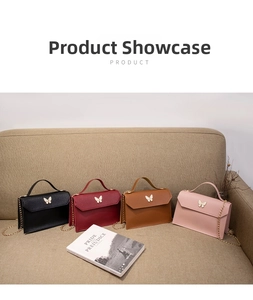 Detailed display of four colorful butterfly handbags with gold chain straps and metallic locks