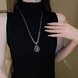 Elegant water drop sweater necklace with dark gem and sparkling diamonds for women