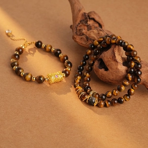 Retro tiger eye stone cylinder bracelet with golden filigree charms for women