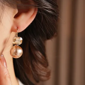 Elegant champagne gold pearl drop earrings with octagonal crystal dangles for women
