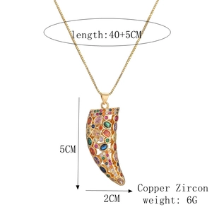 Detailed view of gold wolf tooth necklace with colored zircons and size specifications