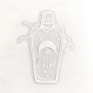 Detail of white suncatcher window sticker with jar, moon and stars embossed patterns