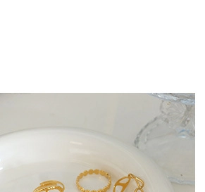 Detailed view of three-tier hollow gold-plated titanium steel C-shaped hoop earrings