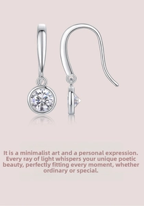 Detail of S925 sterling silver ear hooks featuring bezel-set round brilliant moissanite