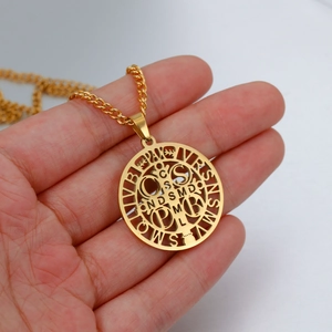 Golden stainless steel St. Benedict medal necklace with cutout crucifix pendant