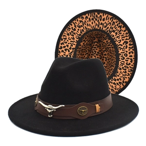 Detail of black wool fedora with leopard print brim and silver bull head leather band