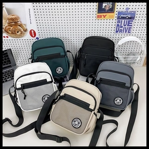 Detail view of five versatile crossbody bags with mesh pockets and adjustable straps