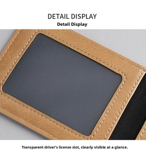 Detail of brown leather wallet featuring a clear ID window and double-stitched edges
