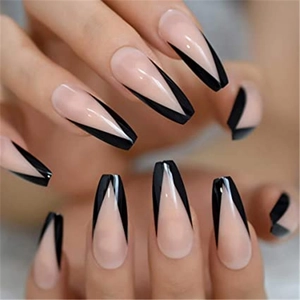 Detail of long coffin press-on nails with nude base and black white French V-shape tips