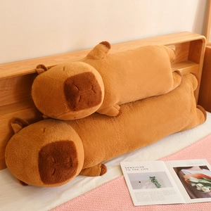 Soft long capybara plush pillow covers in two sizes displayed on a cozy bedroom bed
