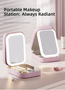 Detail of pink leather makeup organizer with integrated LED mirror and divided storage