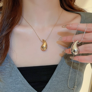 Minimalist metallic water drop necklace with sleek snake chain in gold and silver finish