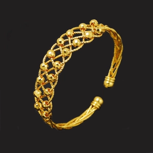 24k gold-plated open bangle featuring an intricate mesh weave and faceted golden beads
