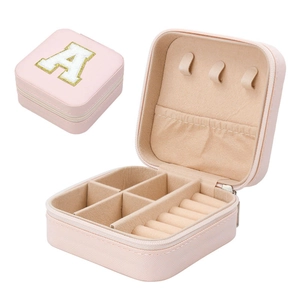 Pink portable travel jewelry organizer box with gold letter A embroidery on top lid