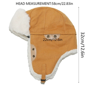 Detail showing ginger yellow trapper hat with white faux fur lining and chin strap buckles
