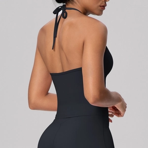 Detail of black halter yoga vest showing open back tie design and high-stretch fabric