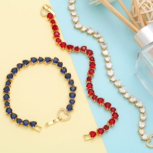 Detailed view of heart-shaped zircon bracelets in blue, red, and white crystal colors