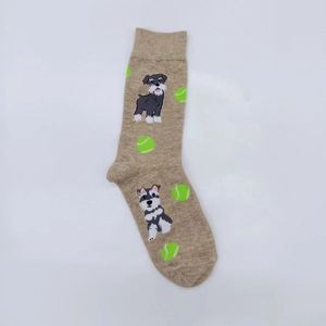 Detail of oatmeal crew socks featuring cute schnauzer dogs and neon green tennis balls