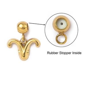 Macro detail of Aries zodiac pendant with internal rubber stopper on gold plated bail
