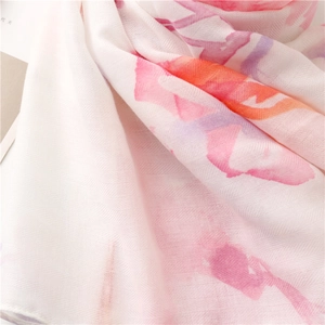 Close-up of lightweight herringbone weave fabric with colorful ink flower print