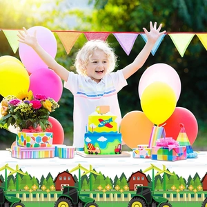 Vibrant farm tractor themed tablecloth for boys birthday party with green harvesters