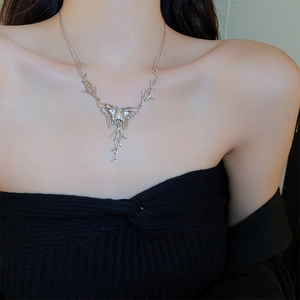 Silver metal butterfly tassel necklace with thorn branch design for women in gothic style