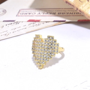 Detail of pixel heart gold ring with clear cubic zirconia stones in macro view