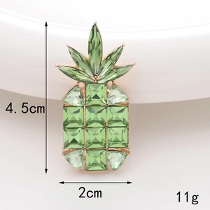 Detail of pineapple charm with green crystals and dimensions 4.5cm by 2cm