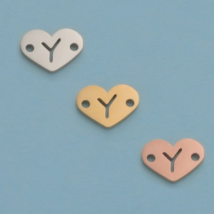 Detailed view of 12mm heart Y-letter charms in silver, gold, and rose gold finishes