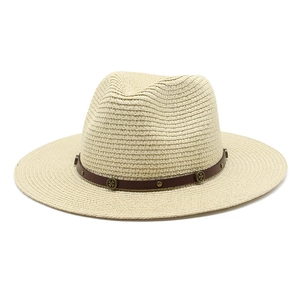 Close-up of beige straw fedora hat with brown leather band and vintage metal studs