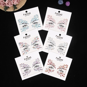 Set of six colorful face rhinestone stickers for music festival makeup on black backdrop