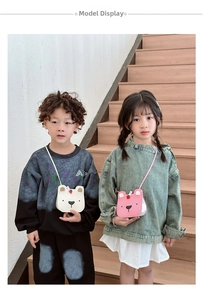Kids bear shaped crossbody bags in cream and pink colors worn by child models