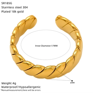 Detailed close-up of a 18k gold plated twist croissant ring made of waterproof stainless steel