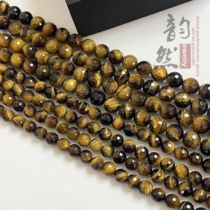 Macro view of faceted natural yellow tiger eye stone beads with silky luster for jewelry DIY