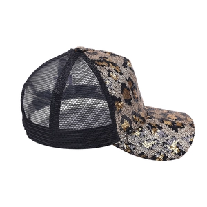 Detailed view of sequin leopard print patterns and breathable black mesh on baseball cap