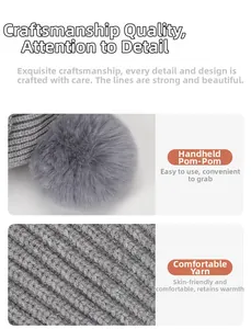 Close-up of gray knit beanie showing soft faux fur pompom and ribbed vertical texture