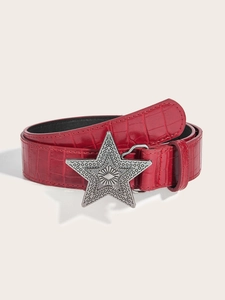 Detail of red crocodile texture belt with silver metal star buckle in vintage style