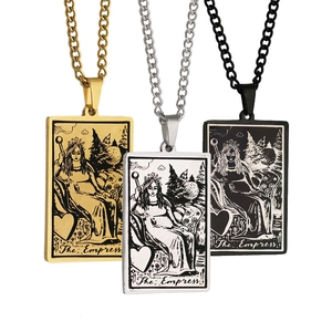Close-up of gold, silver, and black The Empress tarot card pendants with O-chain