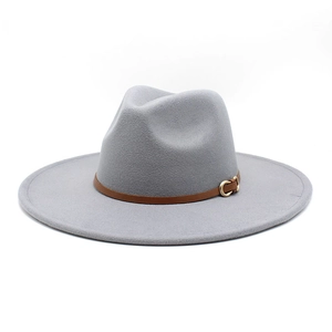 Detailed texture of light grey wool felt fedora hat with brown leather gold buckle band